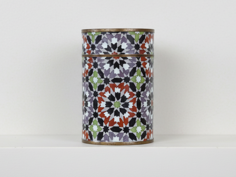 Decorative cylindrical metal container with a colorful geometric pattern - zora store llc