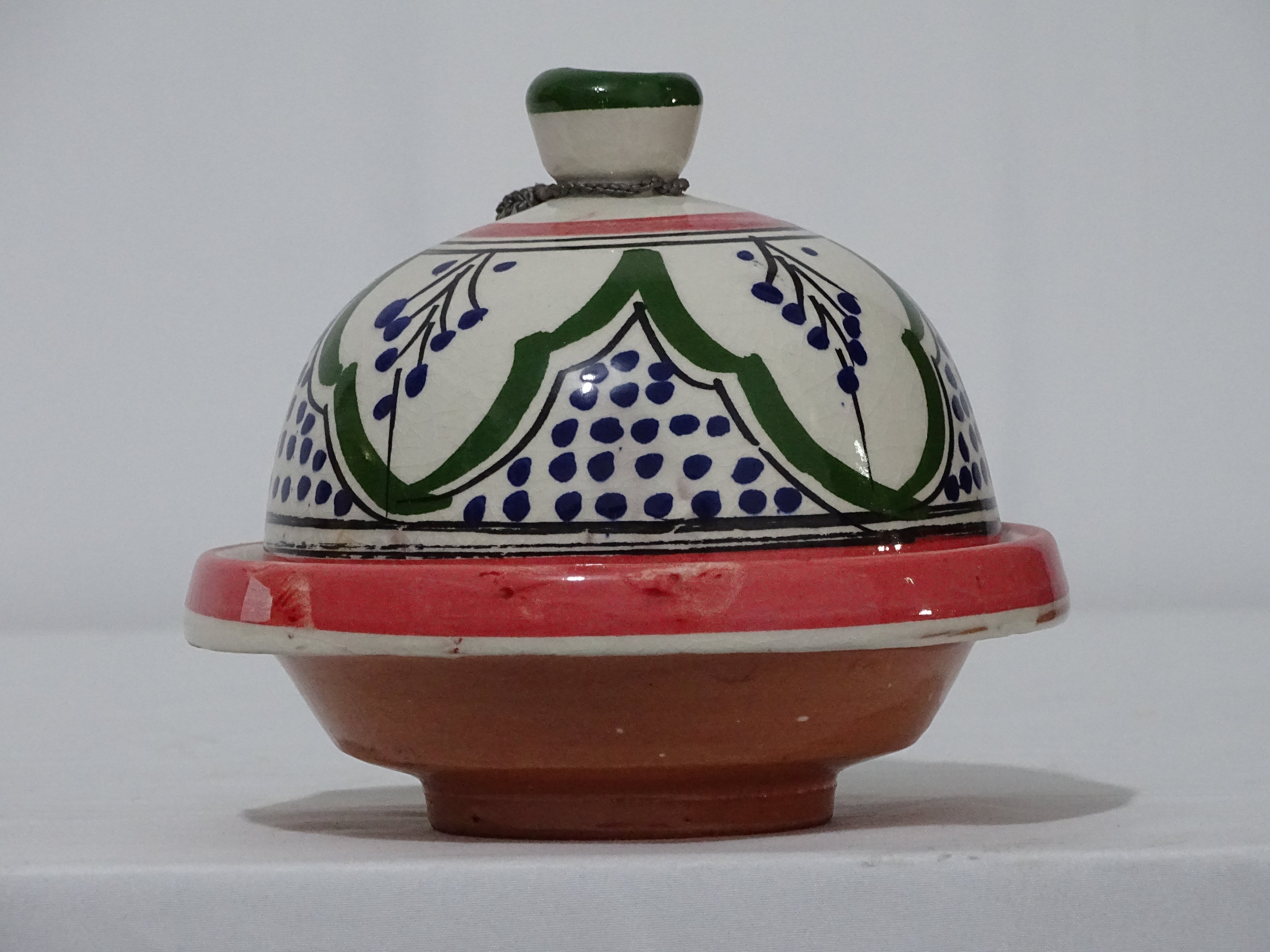 handmade and hand green painted Moroccan tagine.