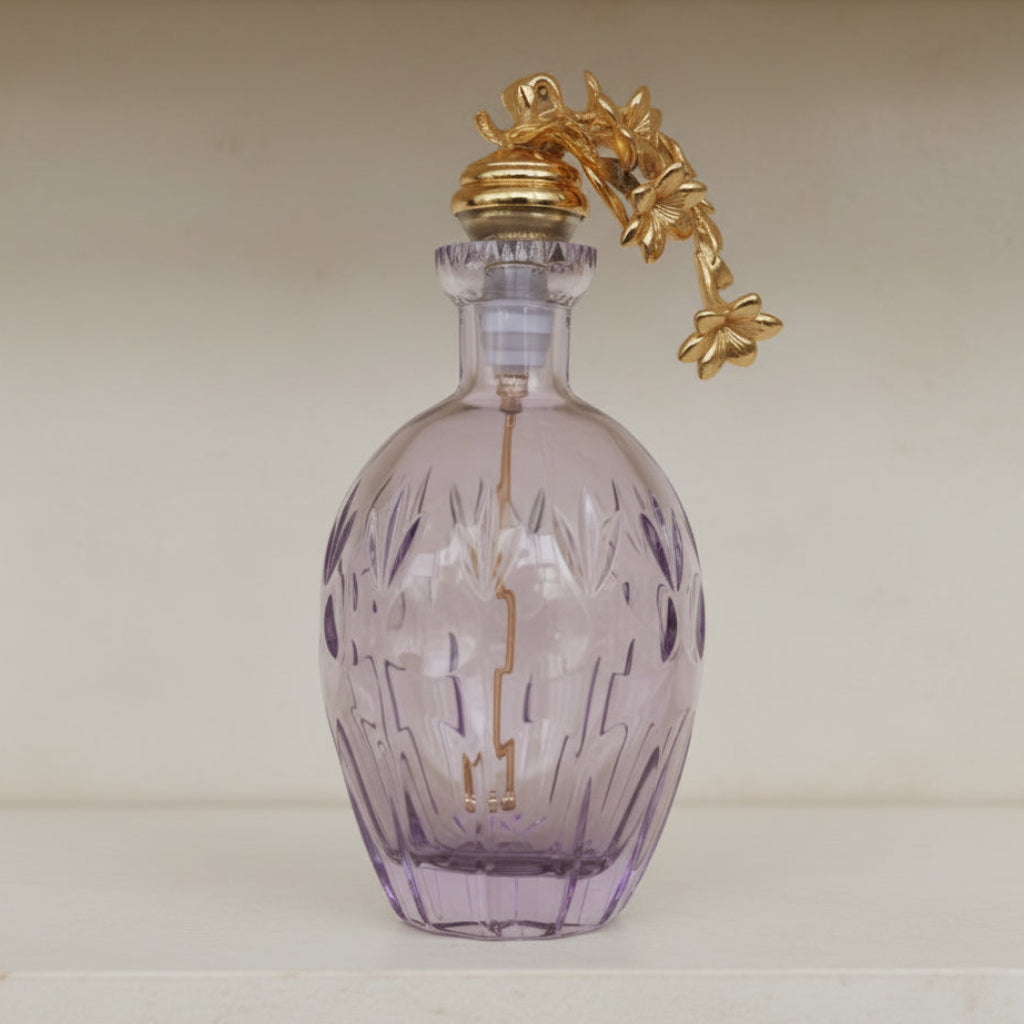 Purple glass perfume bottle with a gold decorative top - zora store llc